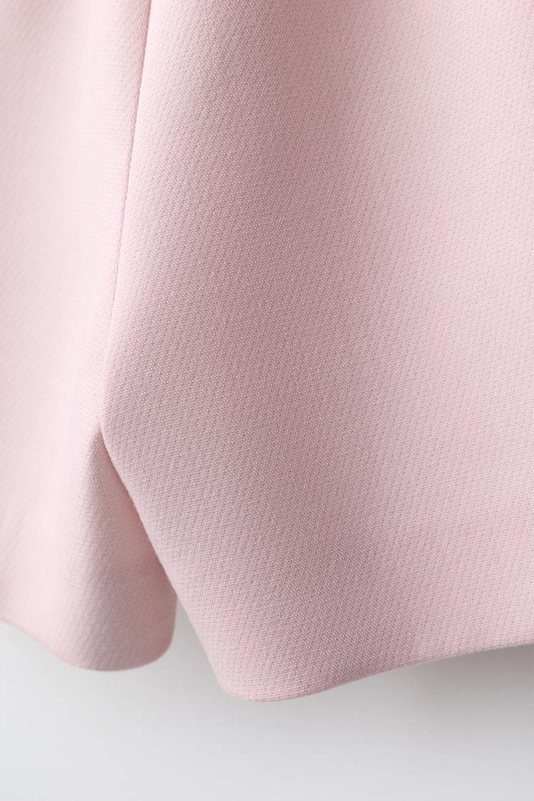 Pantalón corto con falda y cierre de botones 4