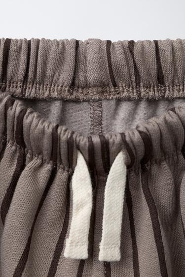 PANTALON À RAYURES ET ÉTIQUETTE - marron-vison de Zara - Image 2