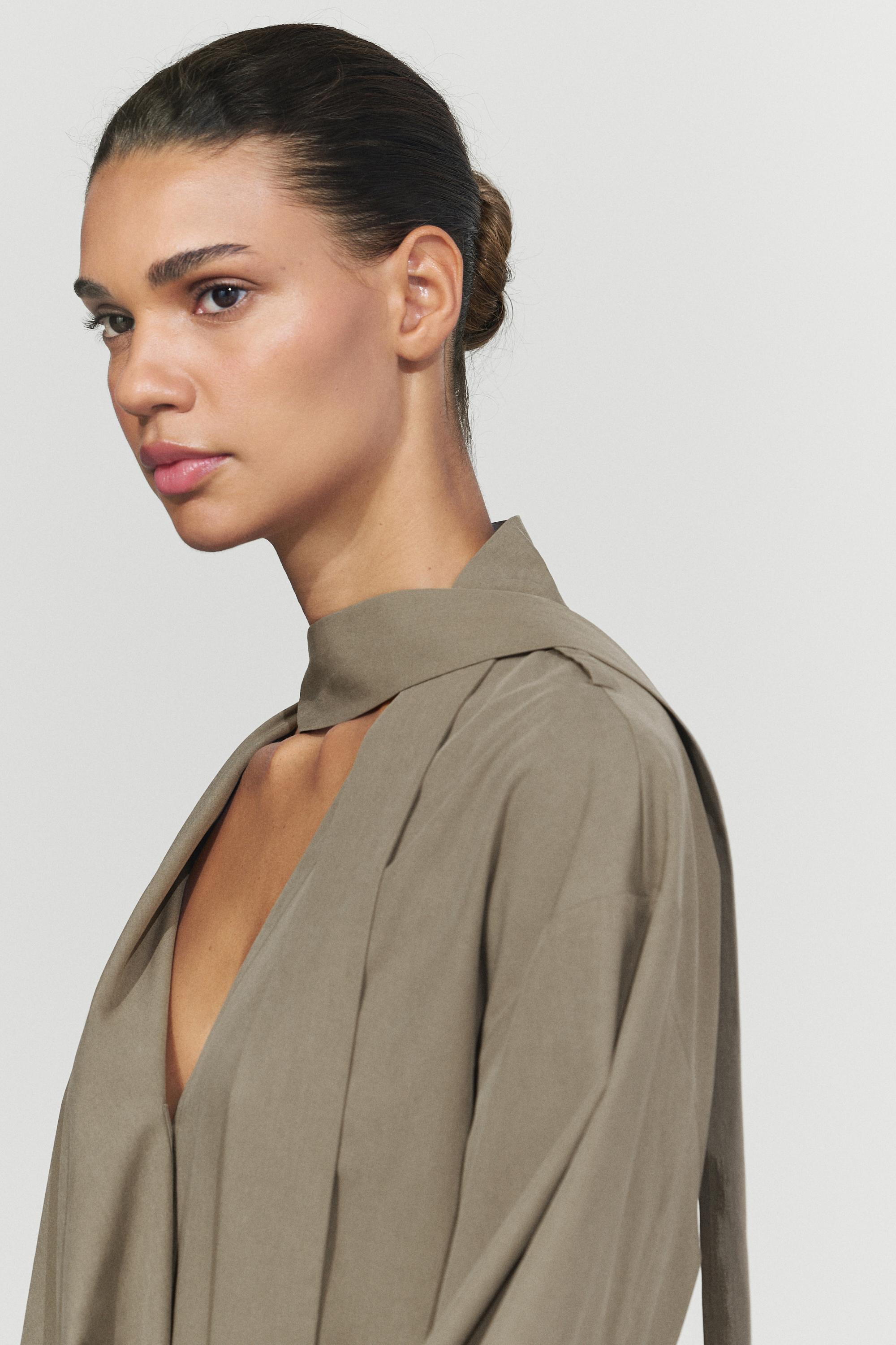 Long flowing cotton-blend blouse with belt