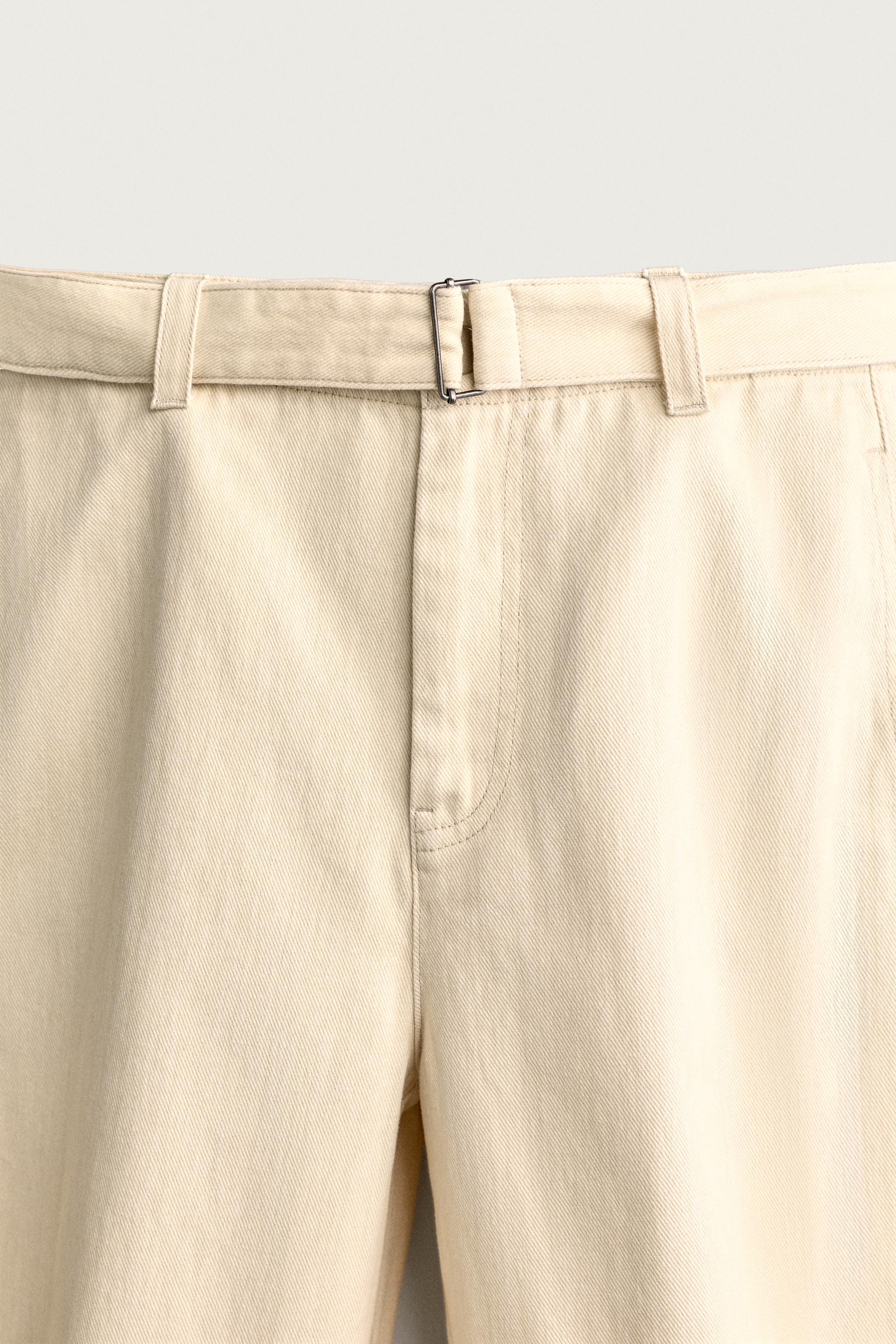 BELTED PLEATED RELAXED FIT PANTS