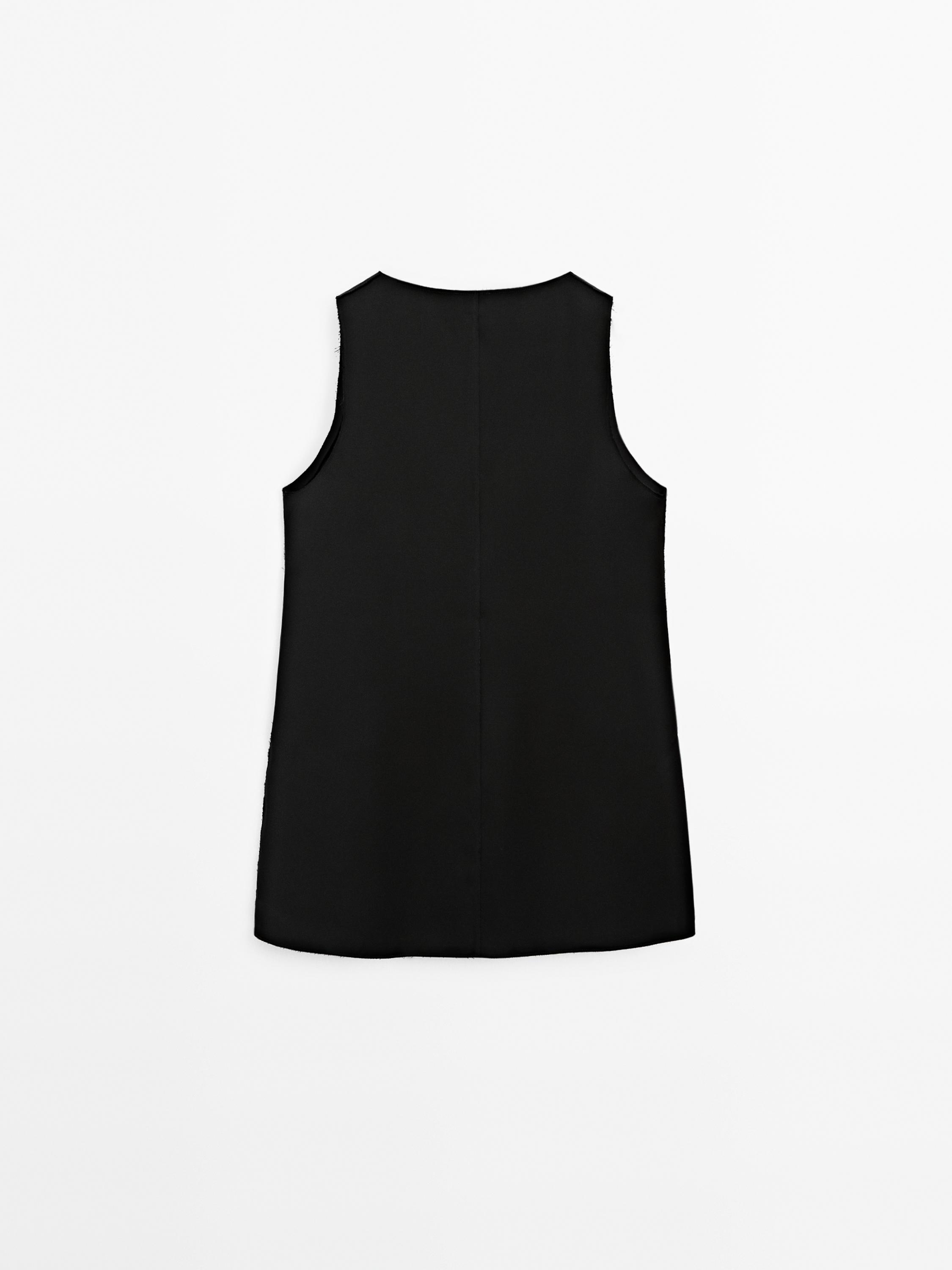 Blouse longue satinée sans manches