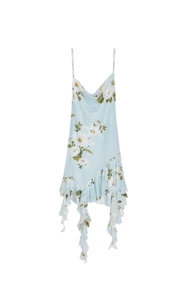Front view of light blue dress with floral print and asymmetric ruffles.