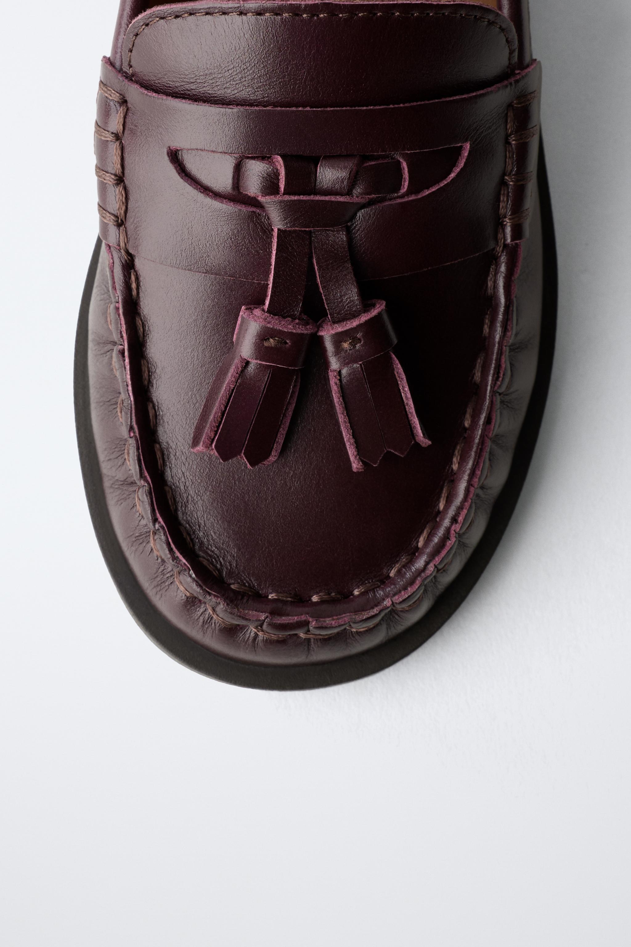 MOCASSINS À POMPONS EN CUIR LIMITED EDITION