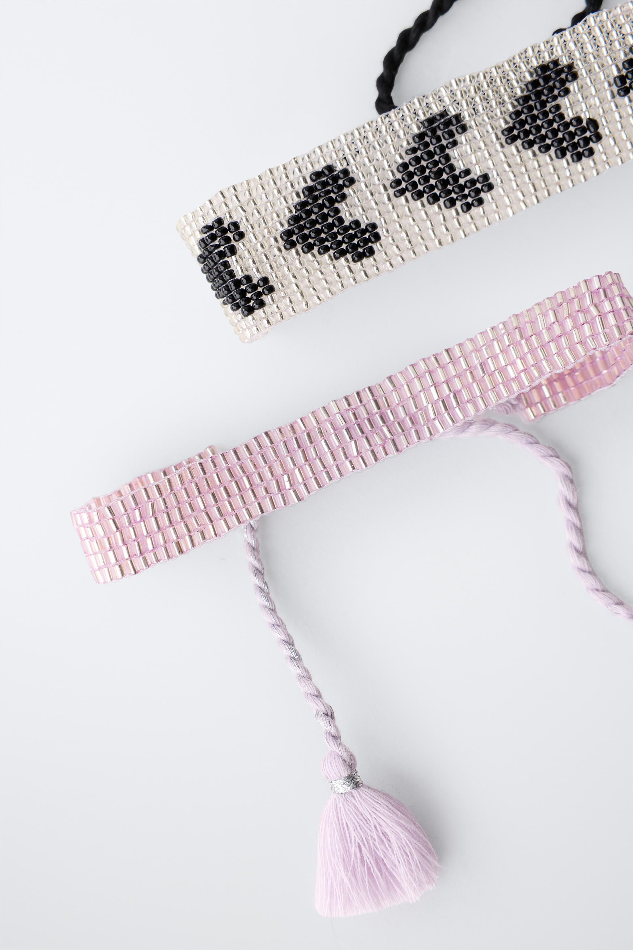 LOT DE DEUX BRACELETS AVEC FANTAISIE ÉTOILE