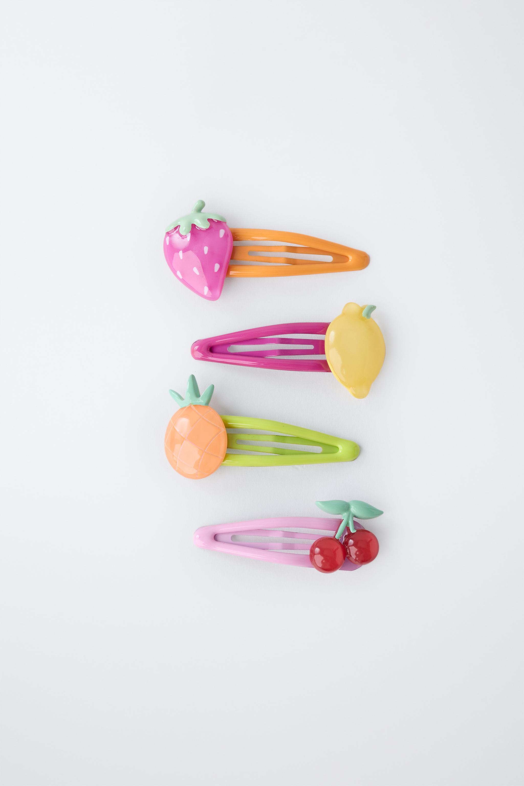 LOT DE QUATRE PINCES FRUITS
