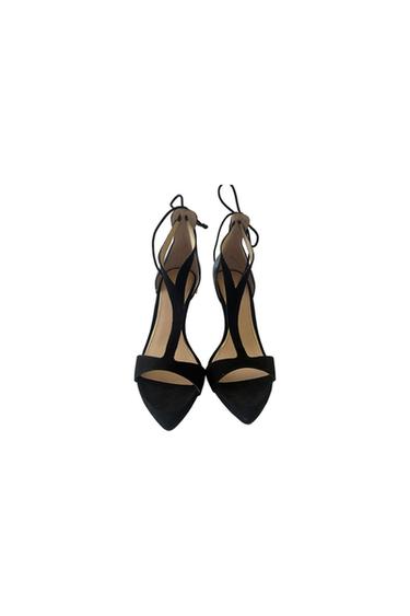 Black high-heeled court sandals with a pointed toe, vamp straps and ankle-tie laces against a white background.