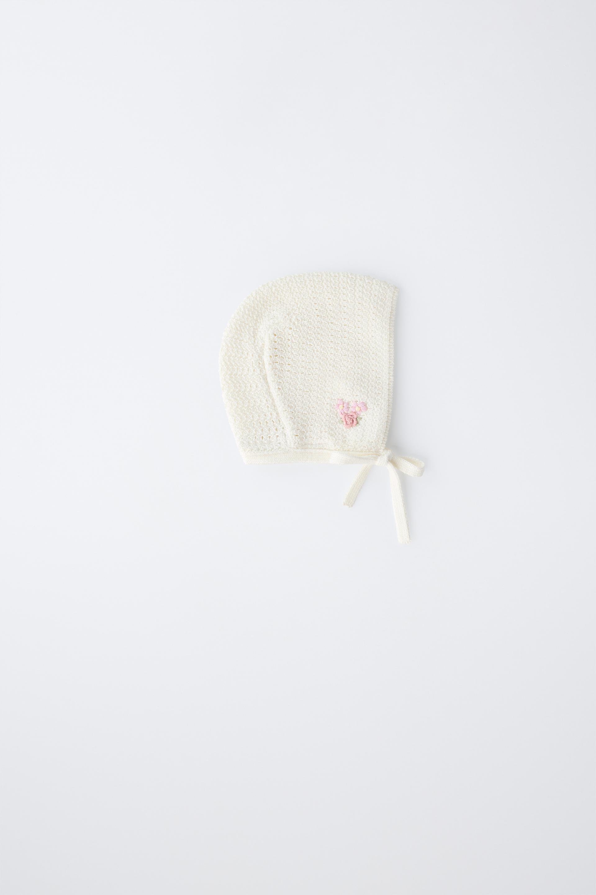 Knitted Bonnet With Embroidered Flower
