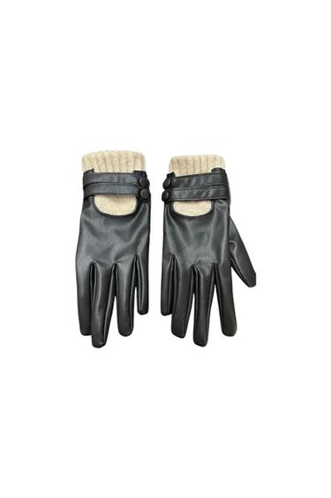 Front view of black gloves with beige knitted cuffs and button fastenings.