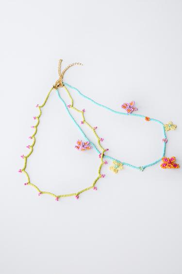 PACK OF TWO NECKLACES WITH FLOWER BEADS - Fuchsia by Zara - Image 1