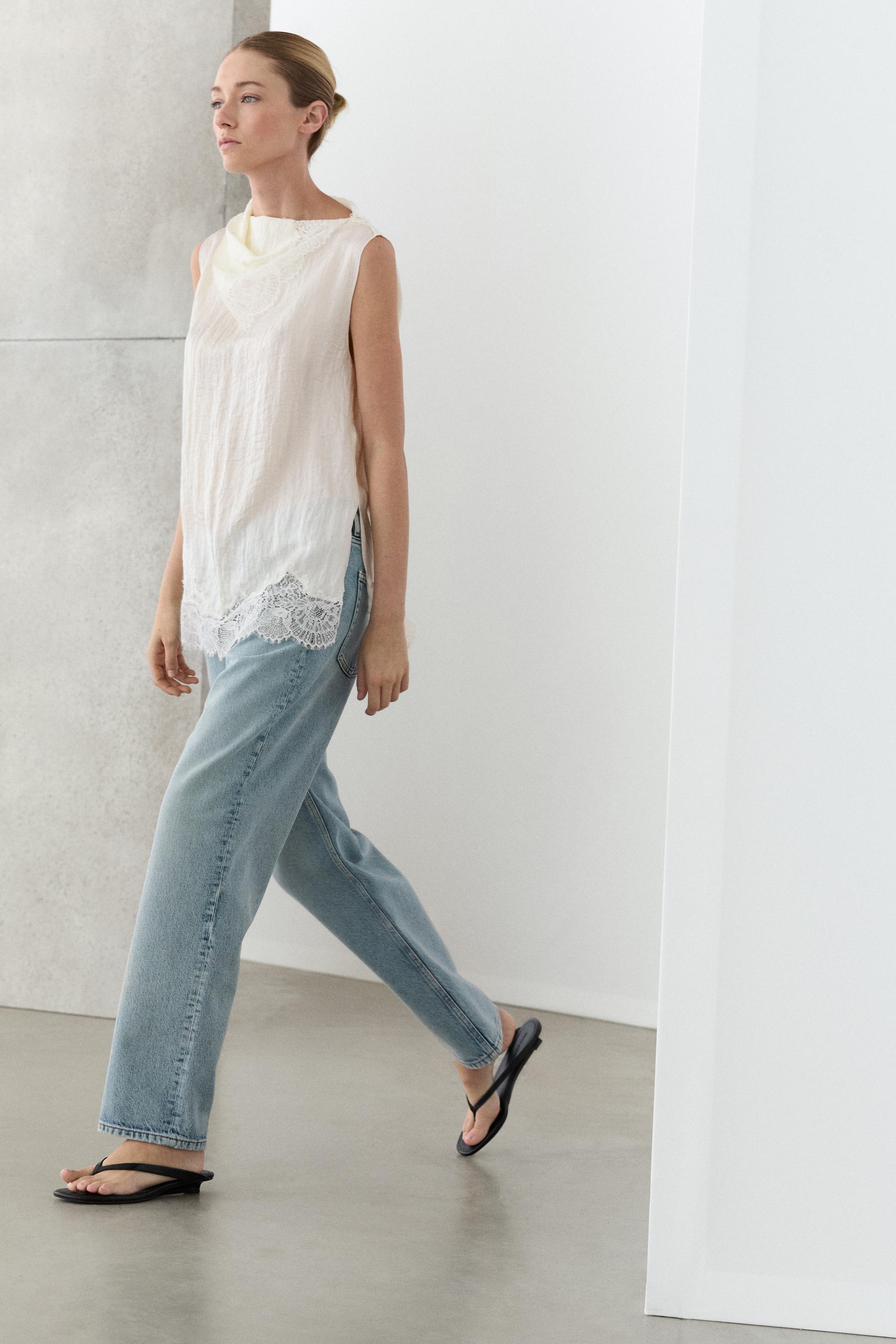 Asymmetric roll neck top with lace detail