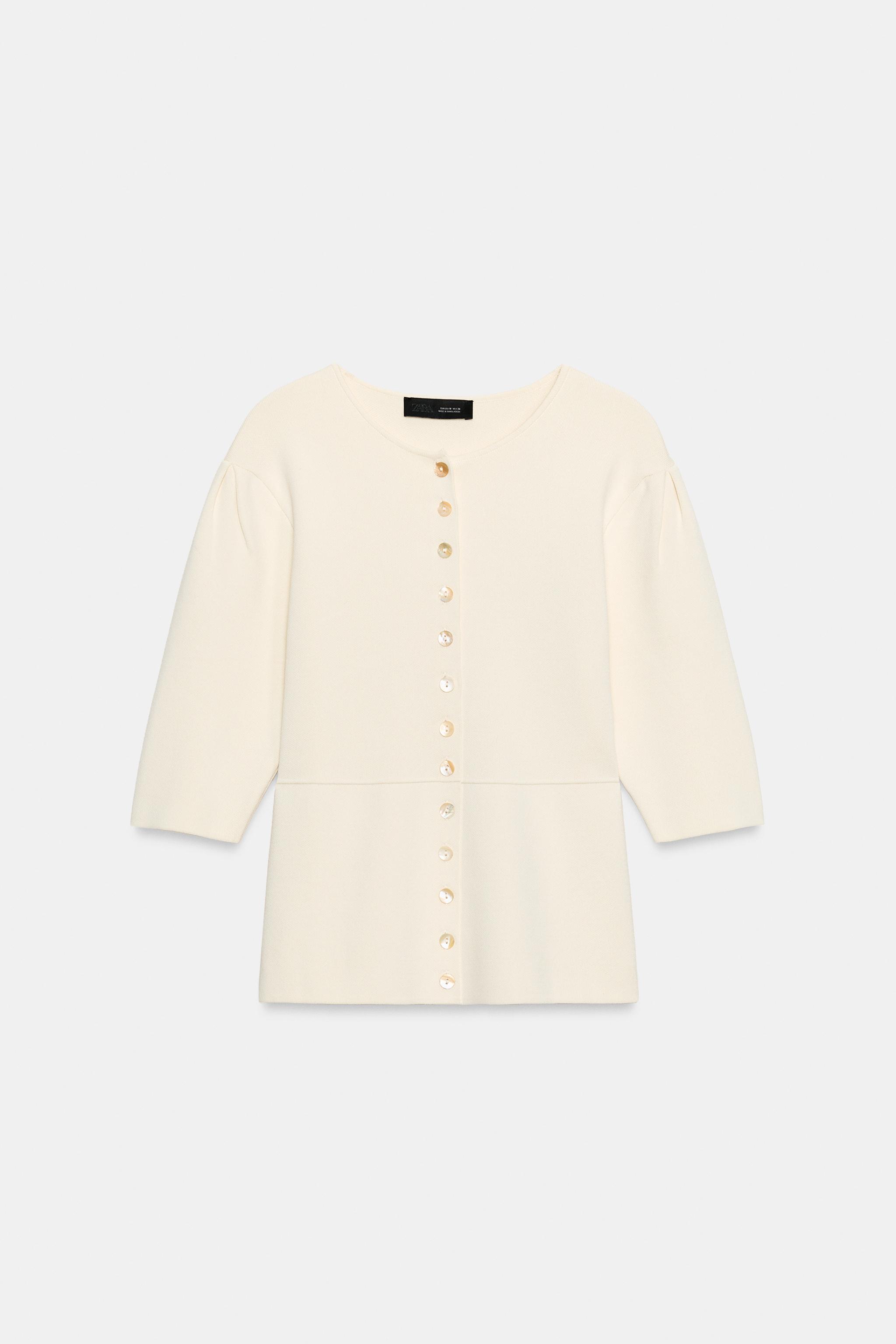 GILET EN MAILLE À MANCHES COURTES