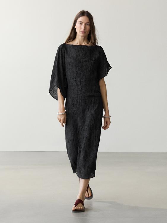 Linen midi dress with asymmetric sleeves from Zara - $220