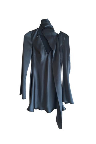 Dark grey satin blouse with a high neck and long tie, long sleeves, and an asymmetrical design on a white background.