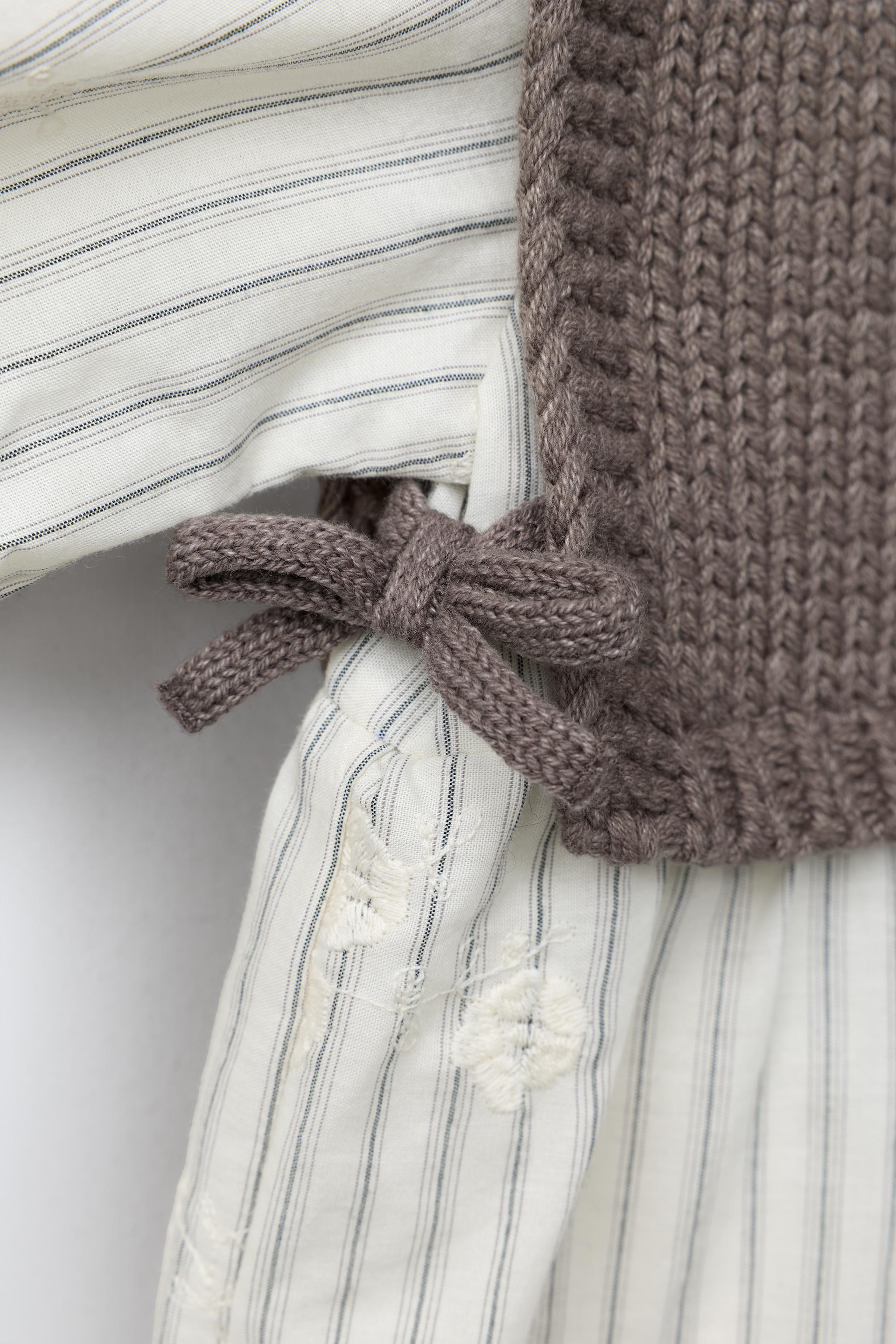 STRIPED DRESS WITH KNIT VEST