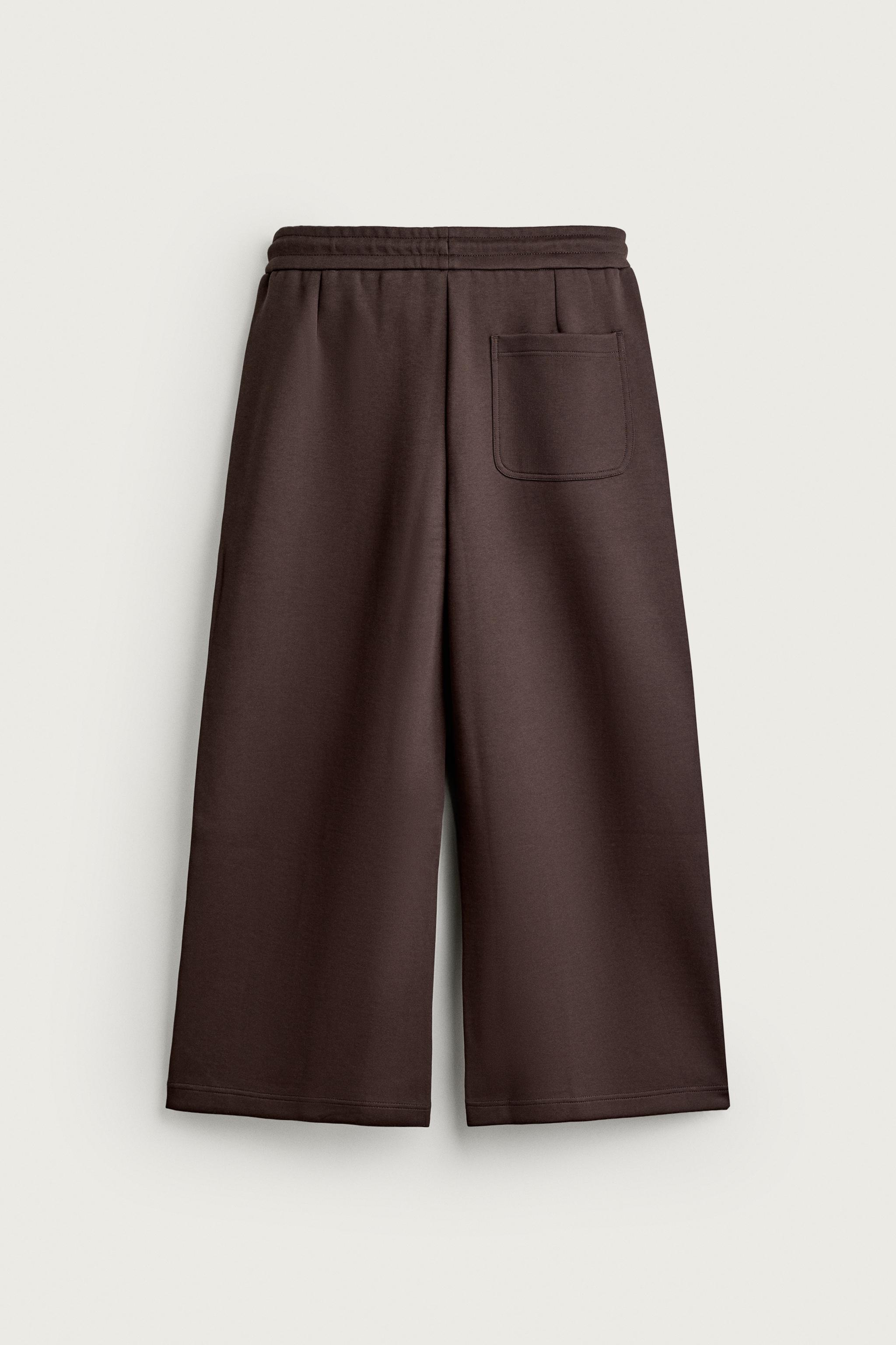 PLEATED BALLOON-FIT PANTS
