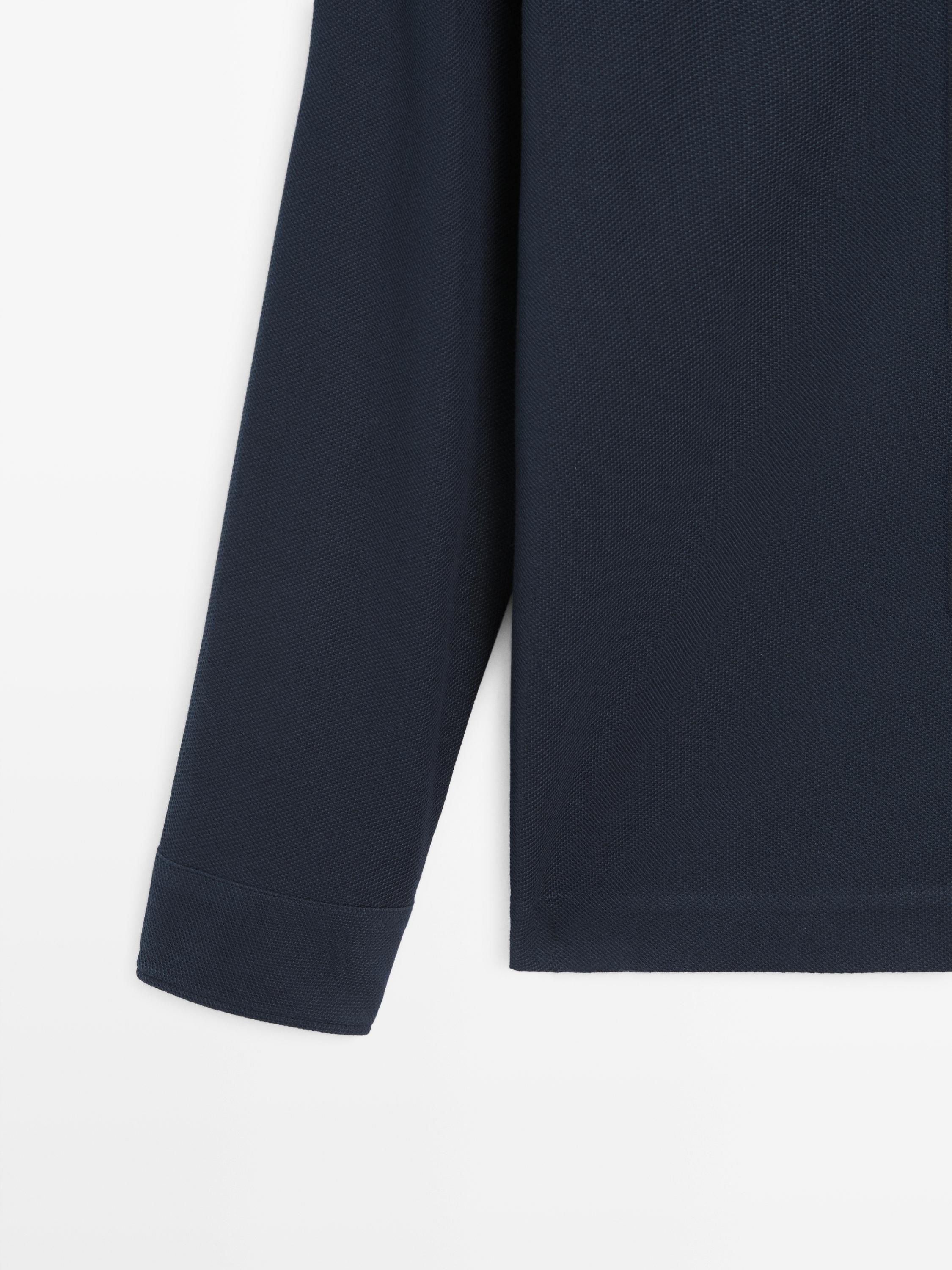 Polo texturé en piqué à manches longues