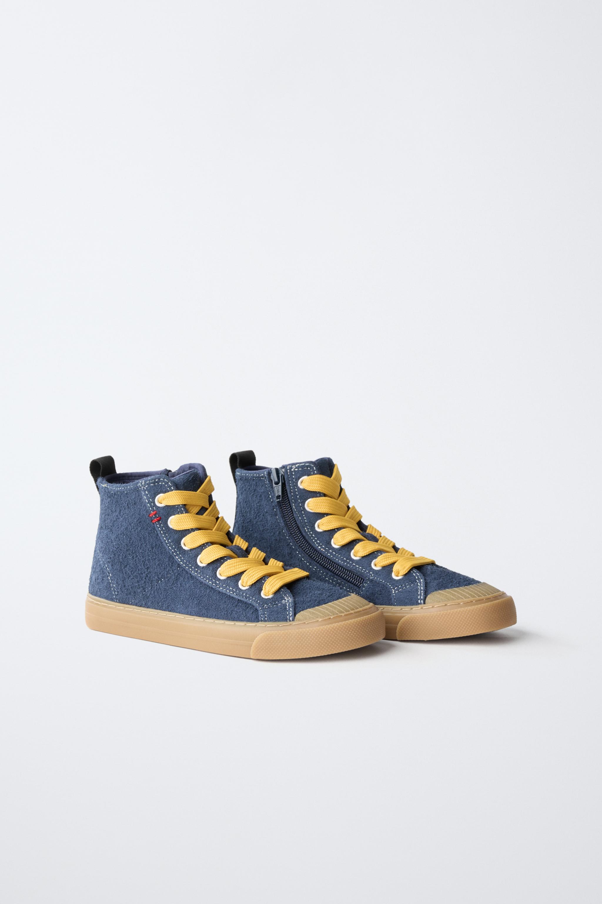 BASKETS MONTANTES EN CUIR