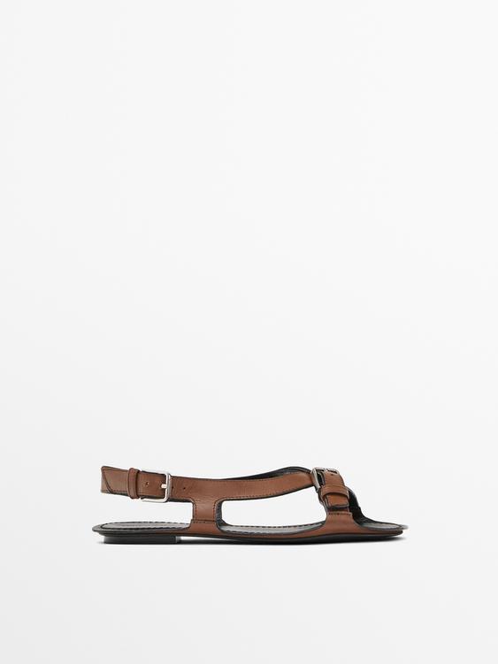 Flat leather sandals with buckles