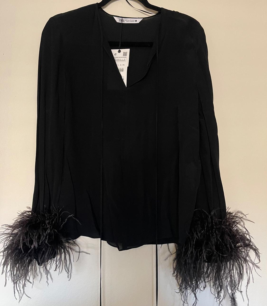 FEATHERED FLOWY BLOUSE