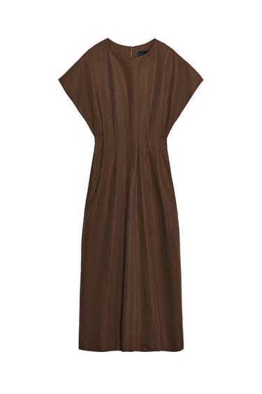 Front view of a brown dress with short, wide sleeves, a loose fit, and pleats at the front.