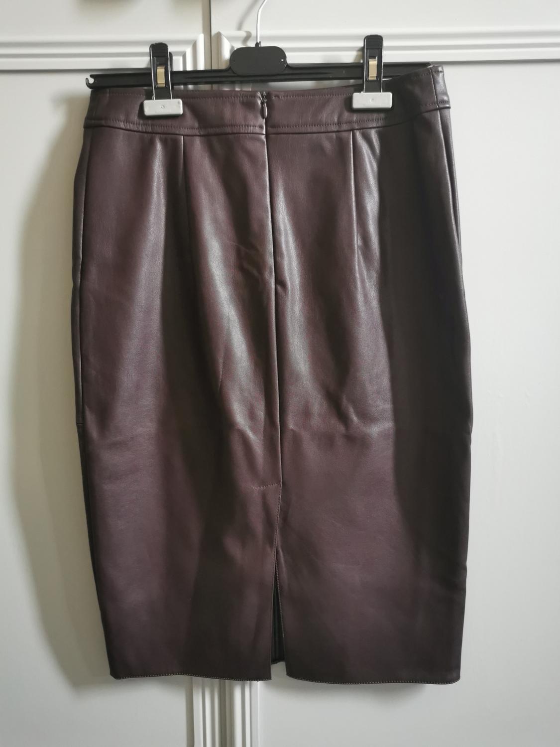 Front view of dark brown pencil skirt with back slit.