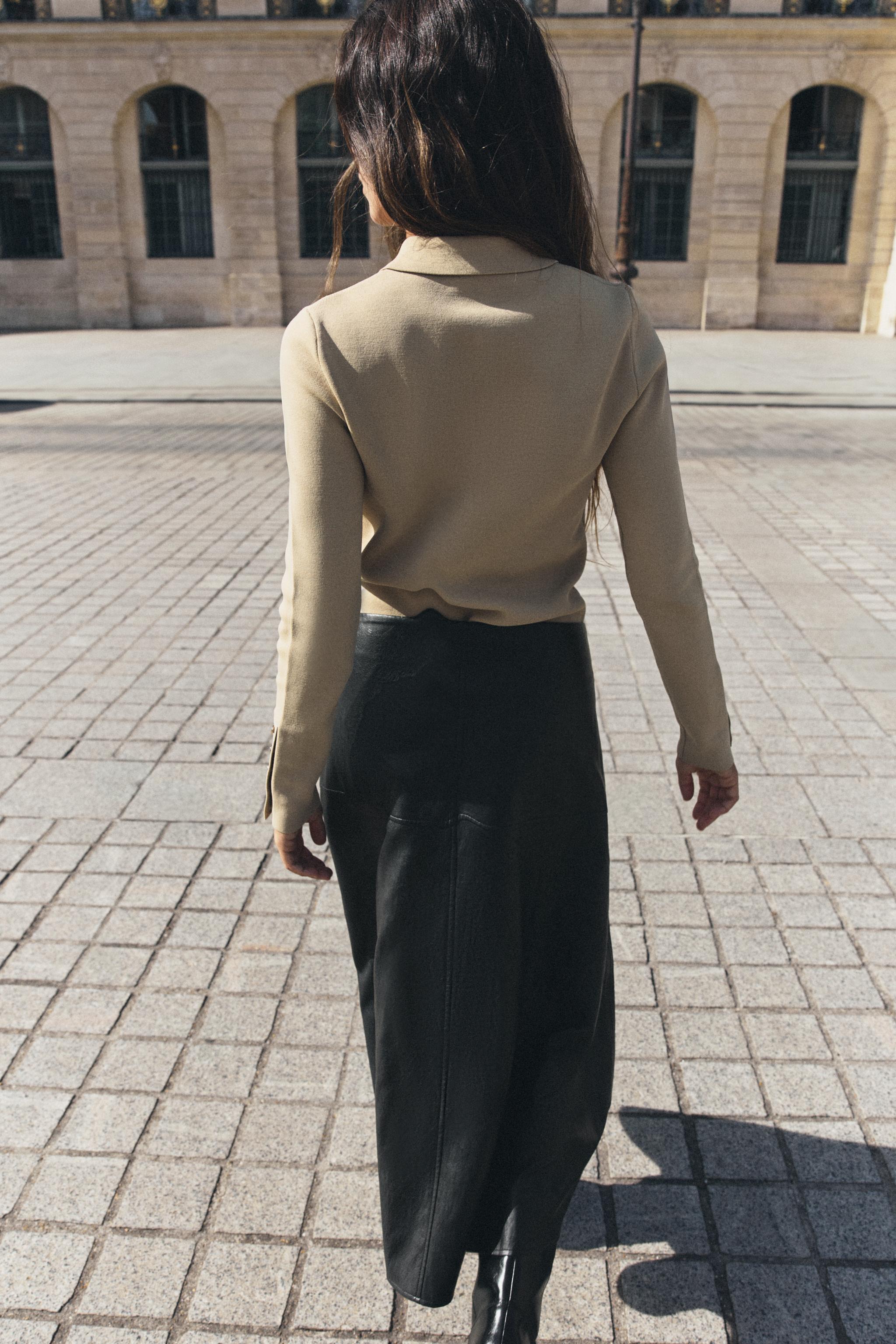 POLO EN MAILLE À PATTES DE BOUTONNAGE