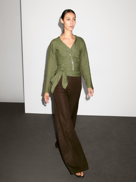 Flowing linen blouse with tie detail at the waist