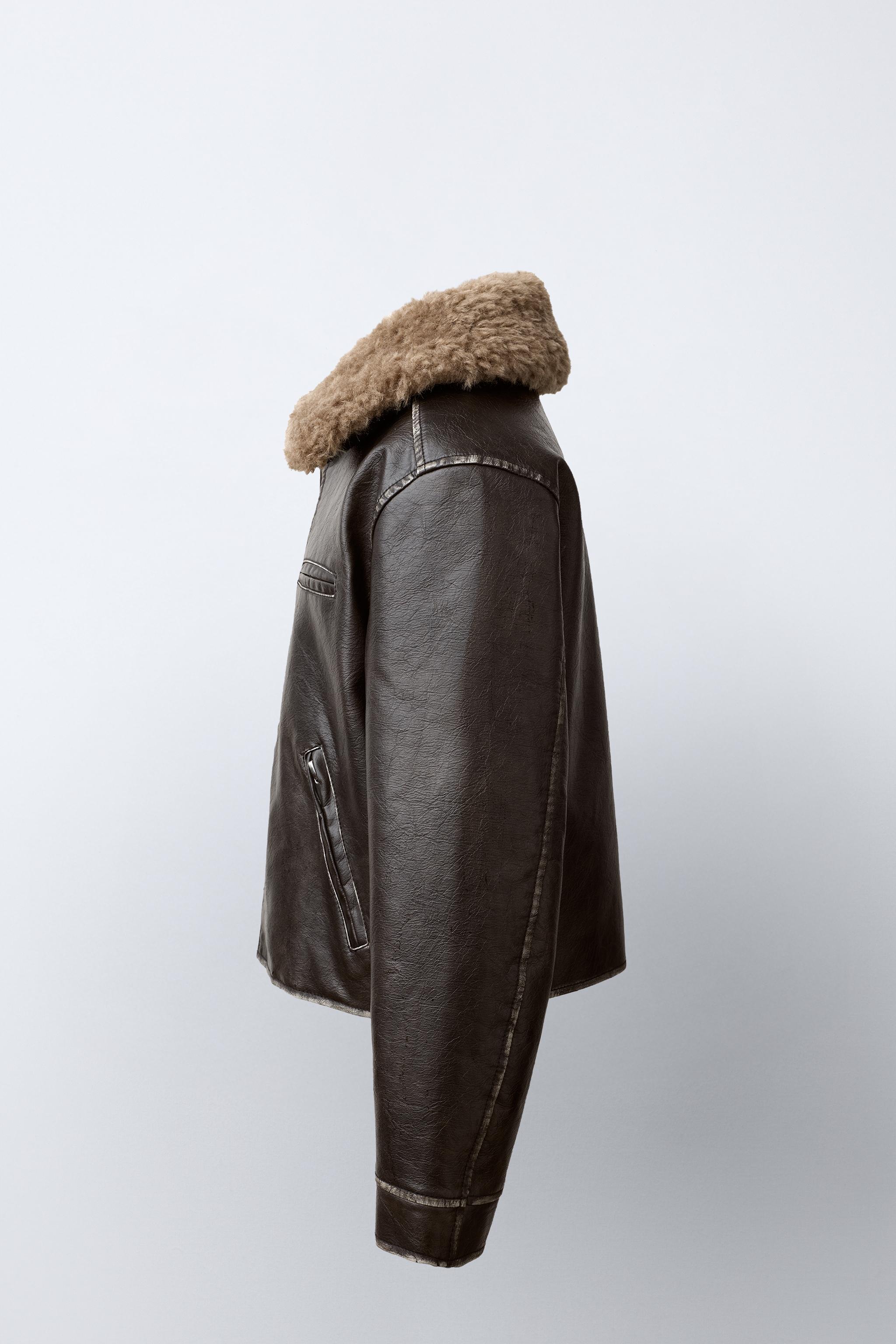 BLOUSON EN MATIÈRE SYNTHÈTIQUE USÉ À COL EFFET FOURRURE