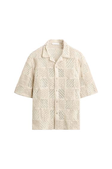 Beige lace shirt with a check pattern, short sleeves, and a classic collar. White background.
