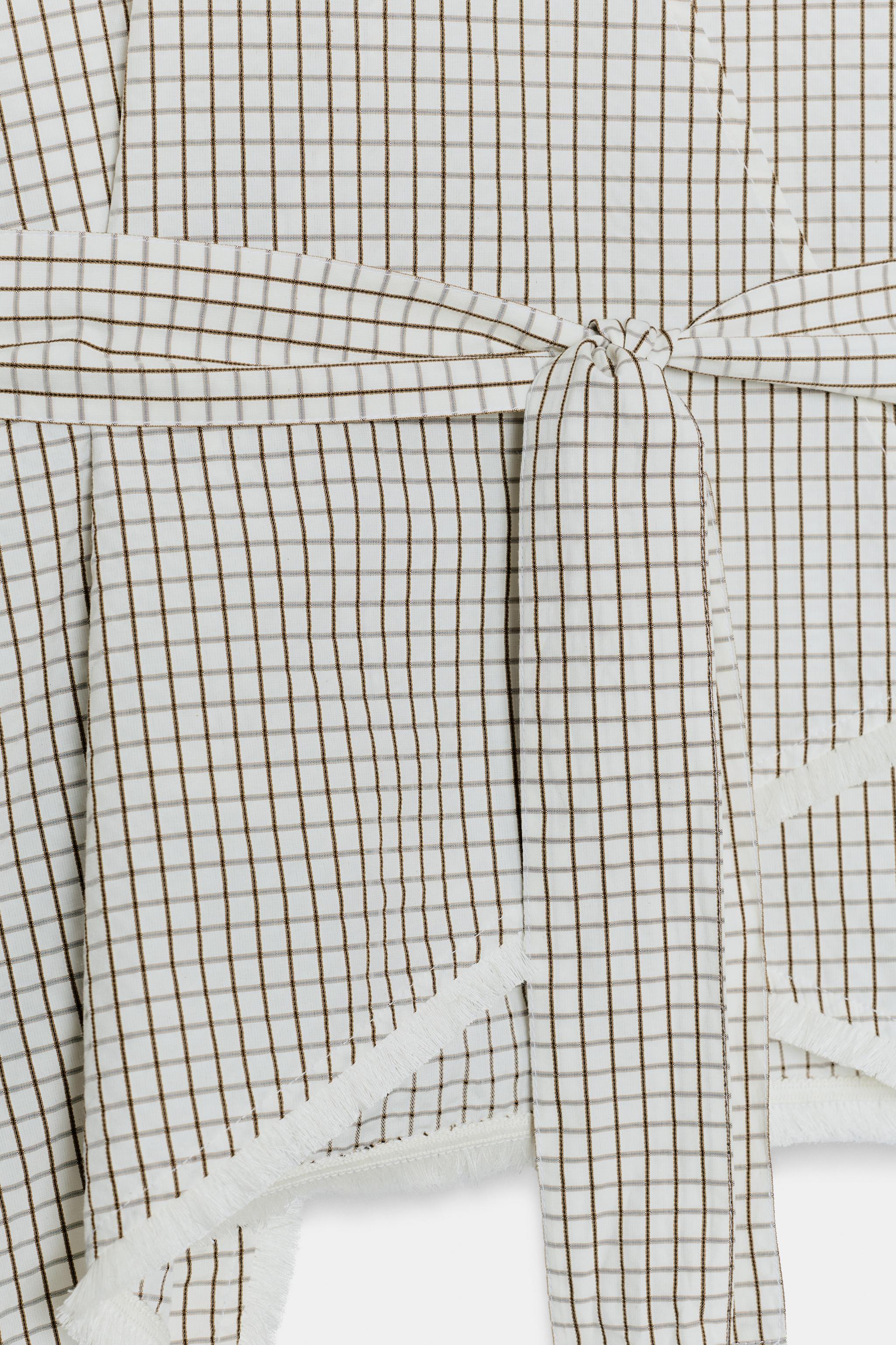GILET EFFRANGÉ À CARREAUX
