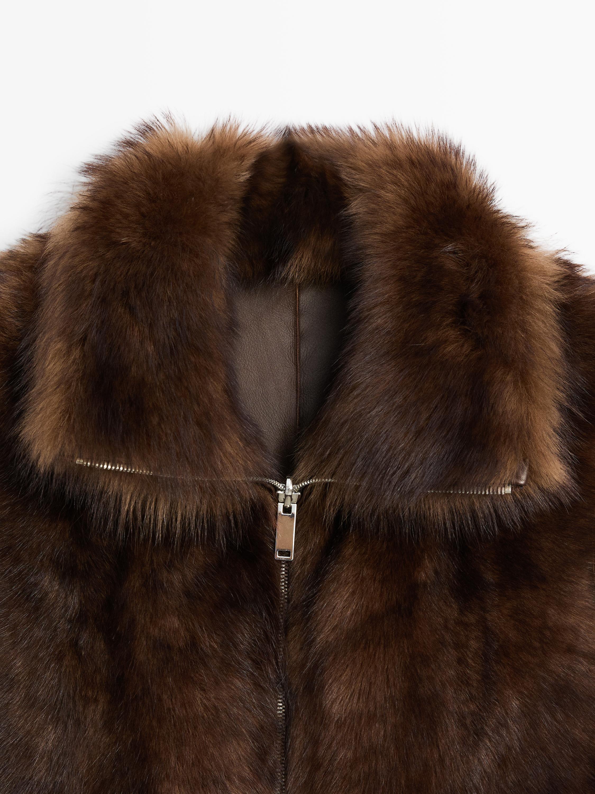 Leather high-neck waistcoat with fur