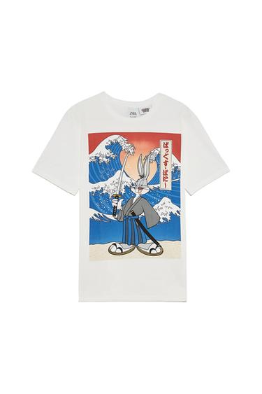 White T-shirt with animated character print dressed as a samurai in front of large waves. Japanese text on the right.
