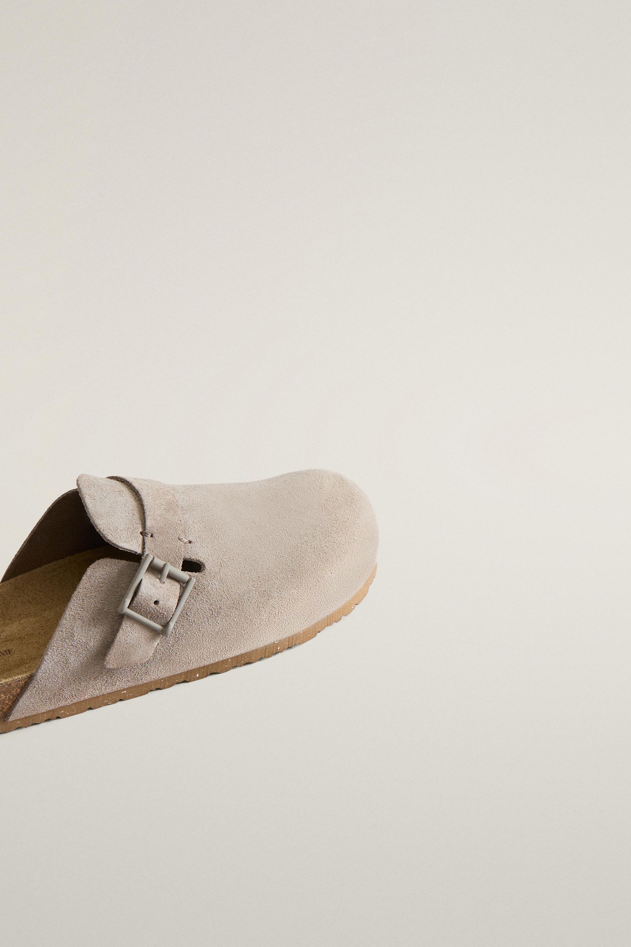 SABOT EN CUIR À BOUCLE ET SURPIQÛRES