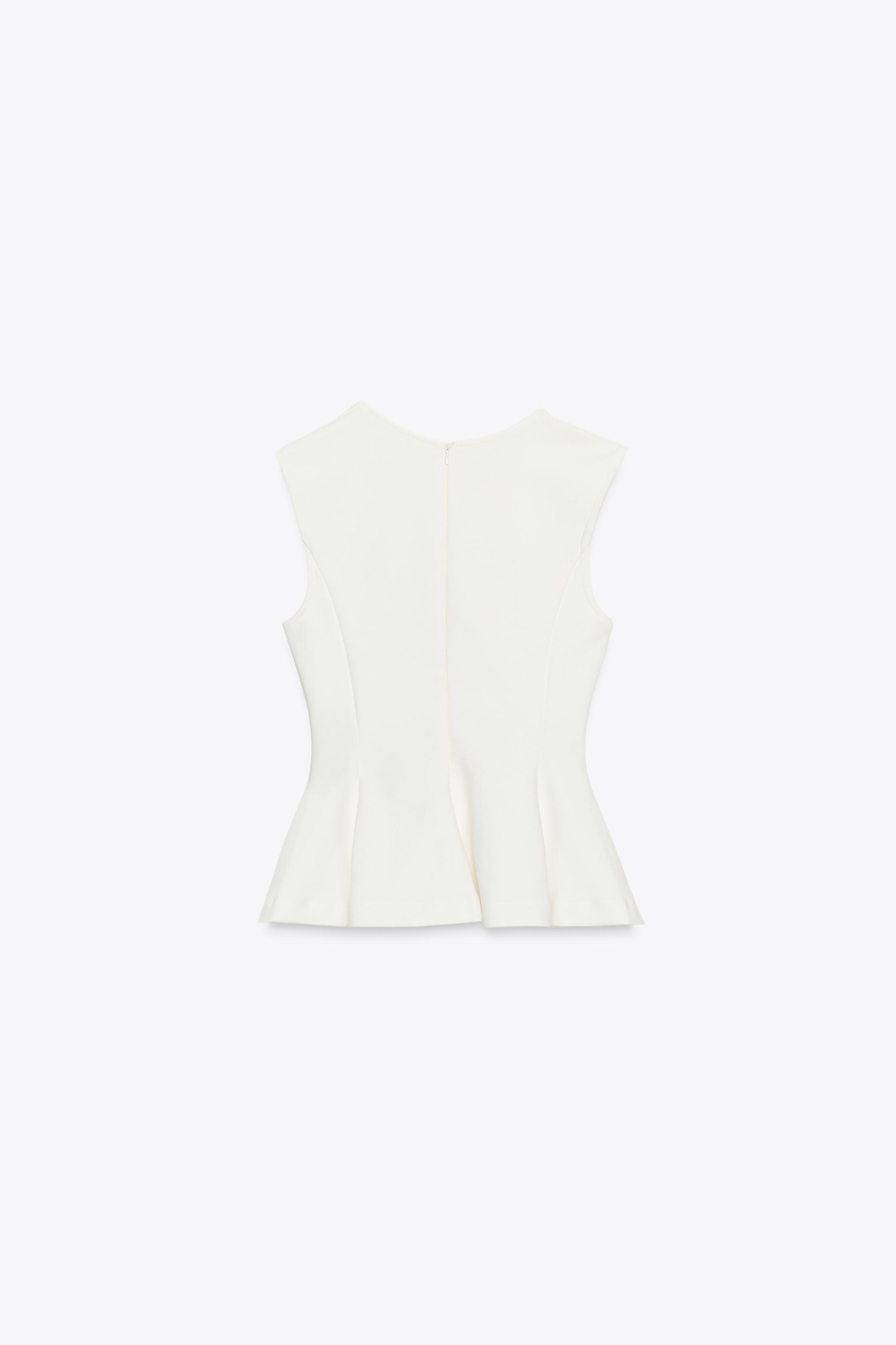 TOP INTERLOCK PÉPLUM SANS MANCHES