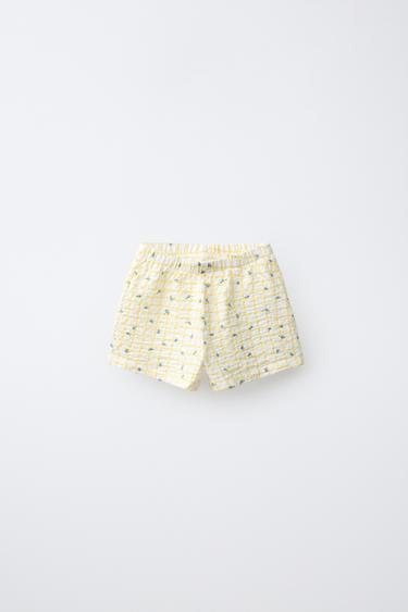 BERMUDA CUADROS Y FLORES - Estampado de Zara