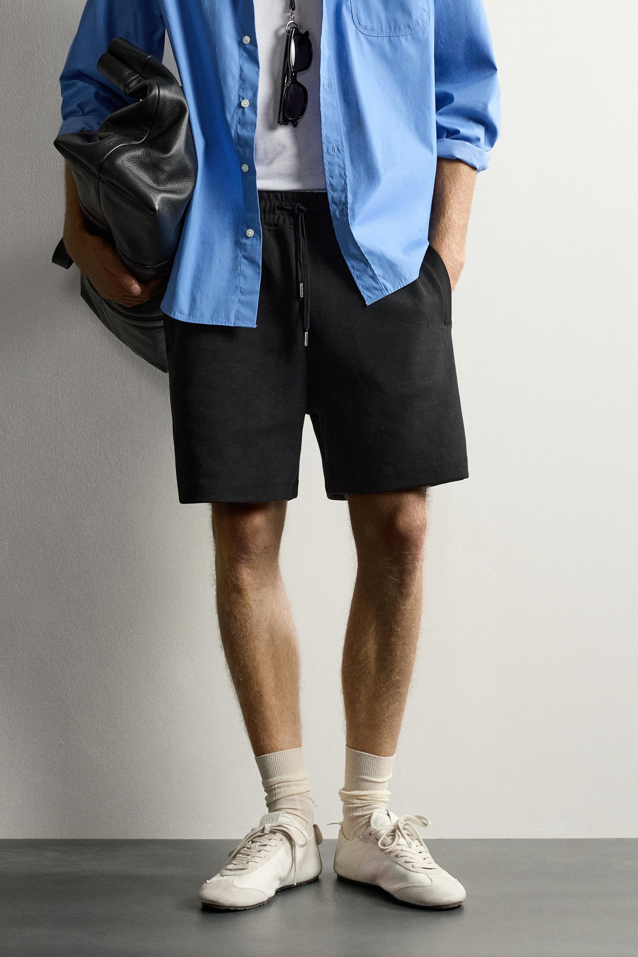 RELAXED FIT INTERLOCK TRACK SHORTS — Black