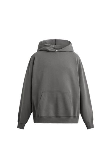 Front view of a grey hooded sweatshirt with long sleeves and a front kangaroo pocket. Ribbed trim on the cuffs and hem.