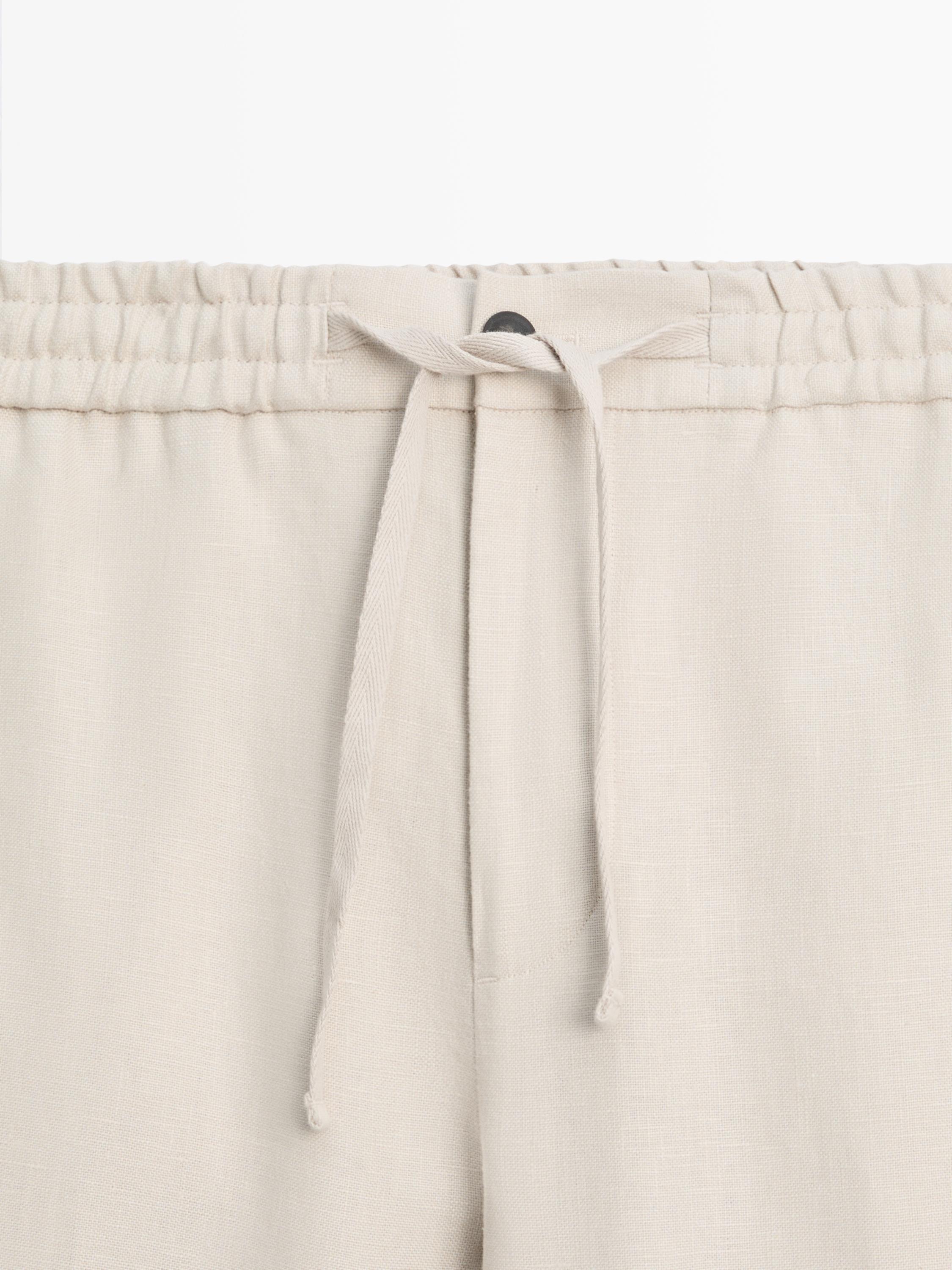 Total look linen trousers with waist detail