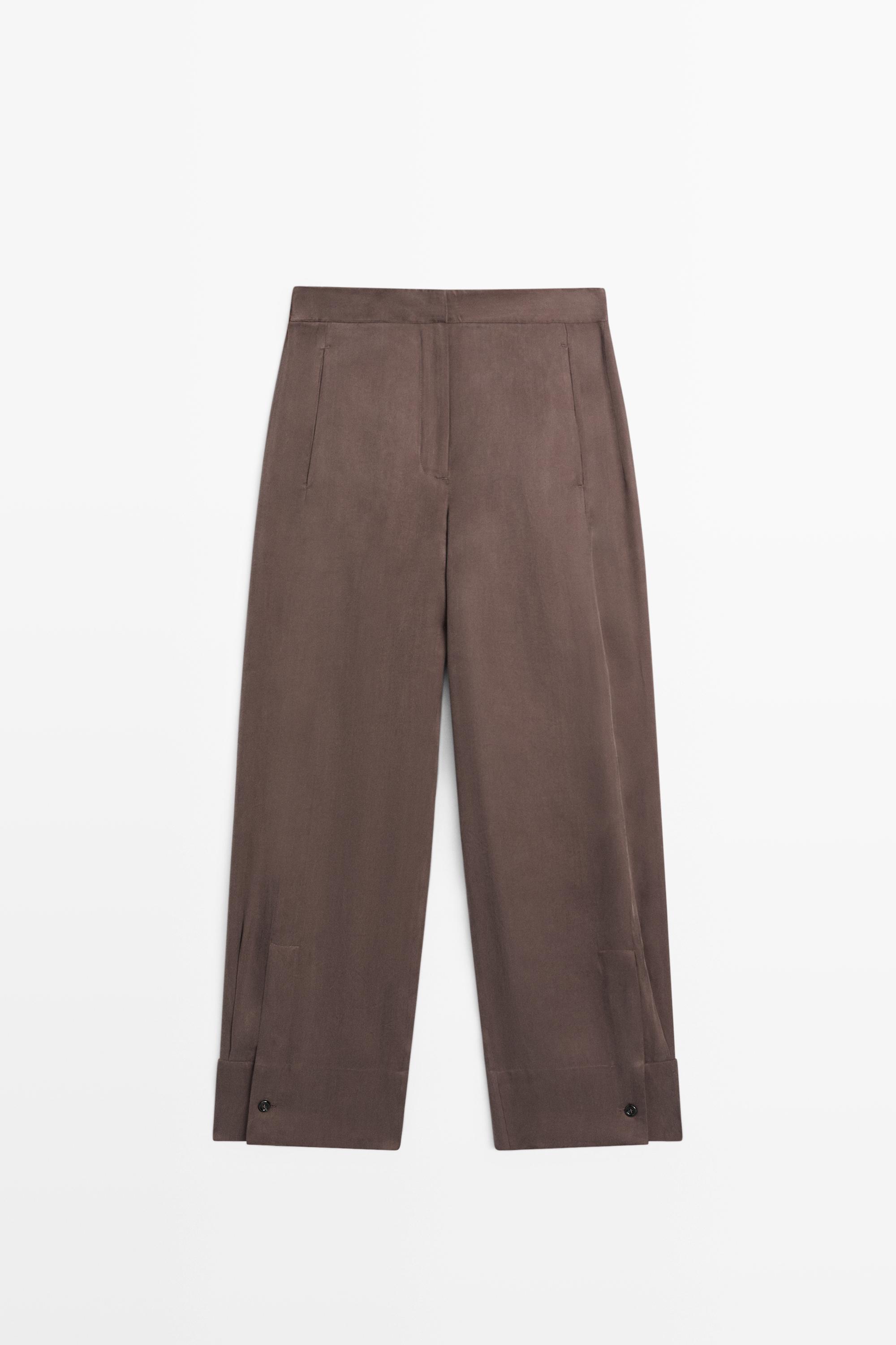 Total look flowing trousers with buttoned hems