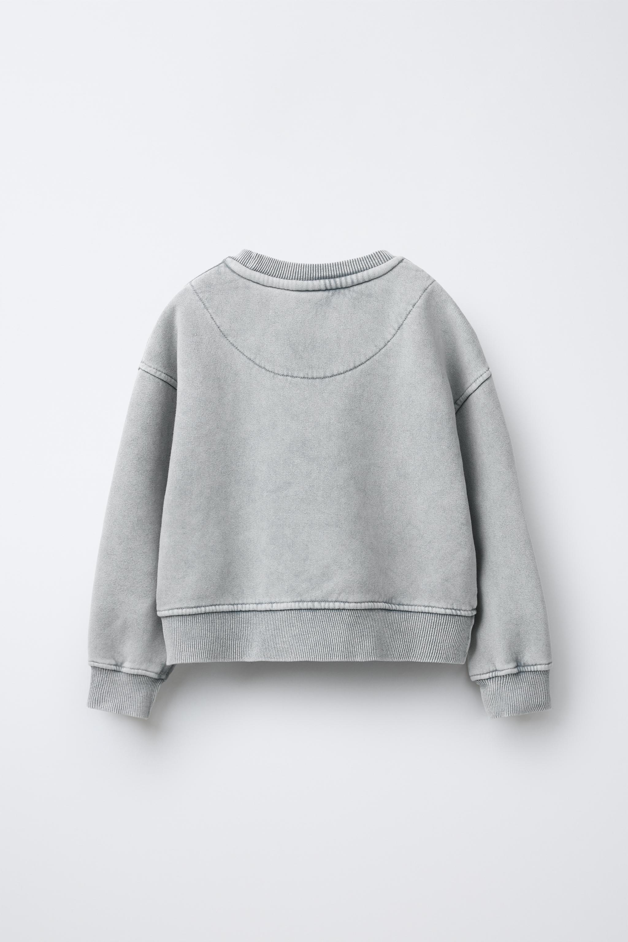 SWEAT EFFET DÉLAVÉ ÉTOILE BRILLANT