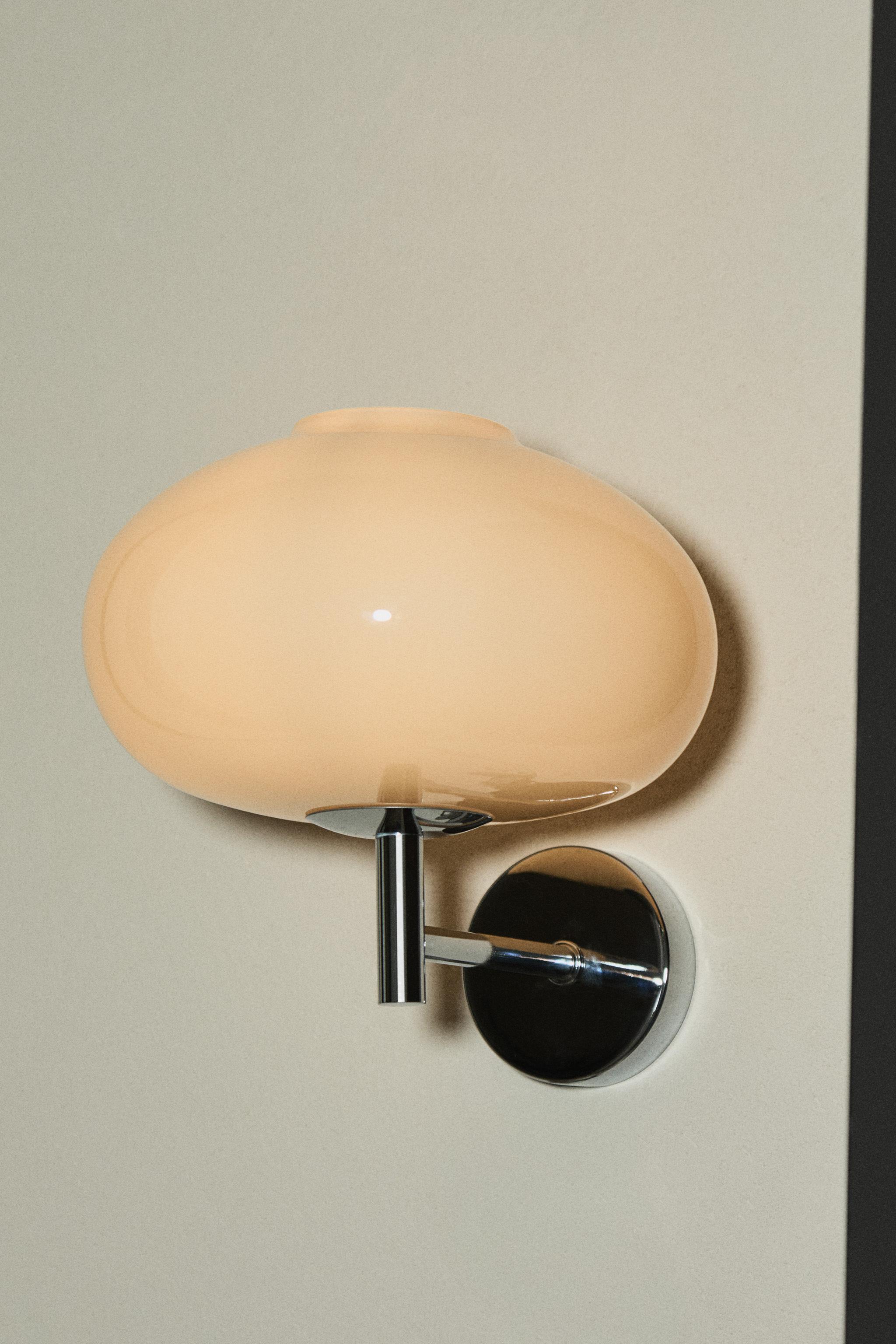 ROUNDED GLASS AND IRON WALL LIGHT