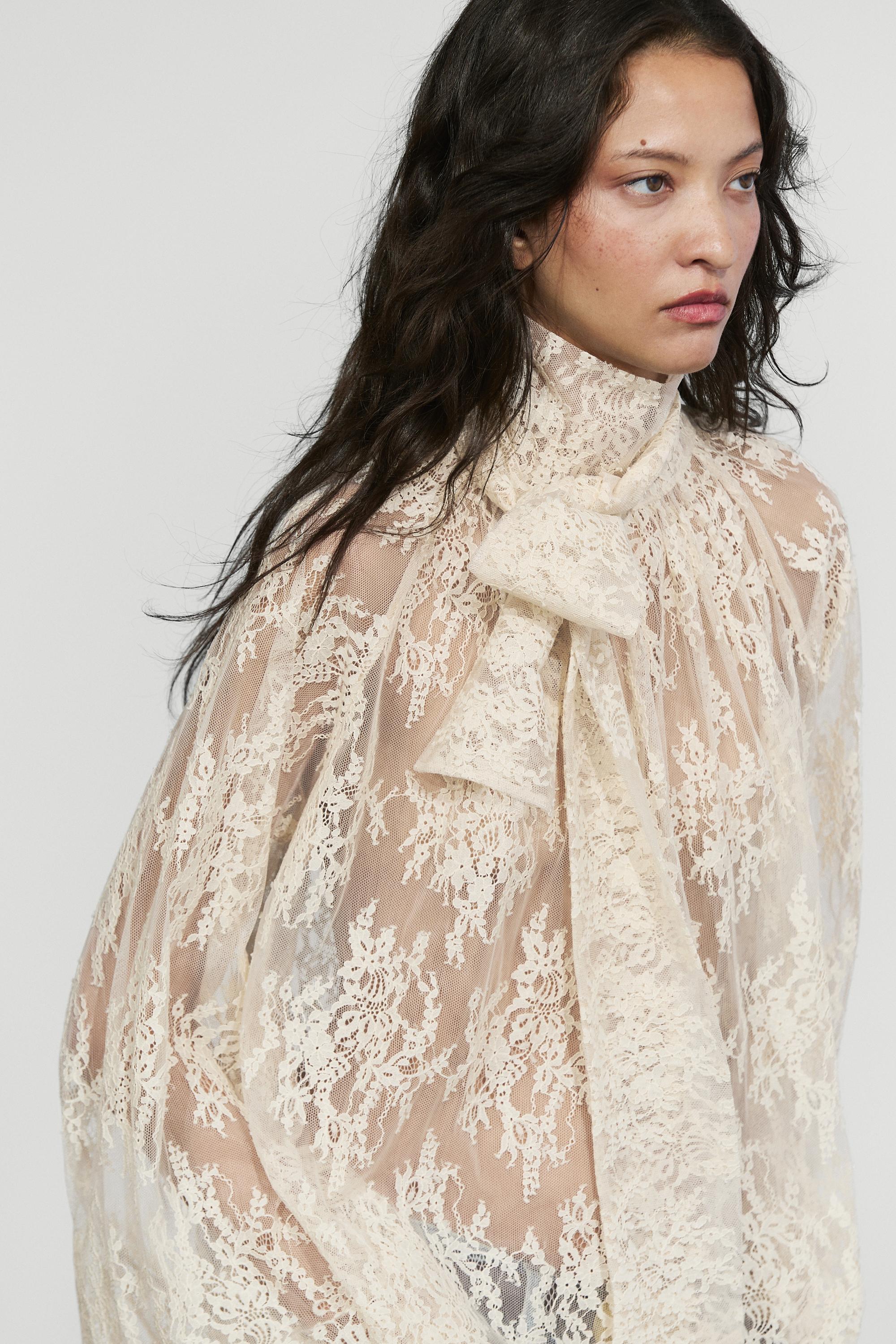 Flowing lace blouse with tie