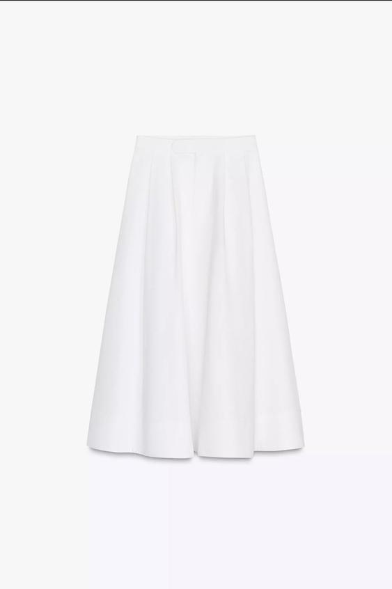 White midi-cut pleated skirt, on a white background.