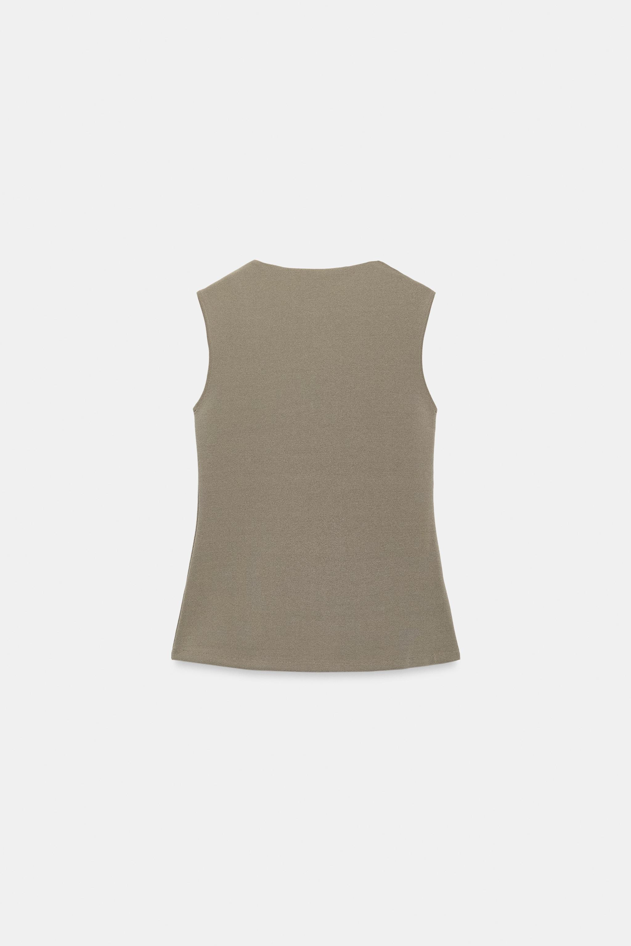 GILET À BOUTONS REVÊTUS