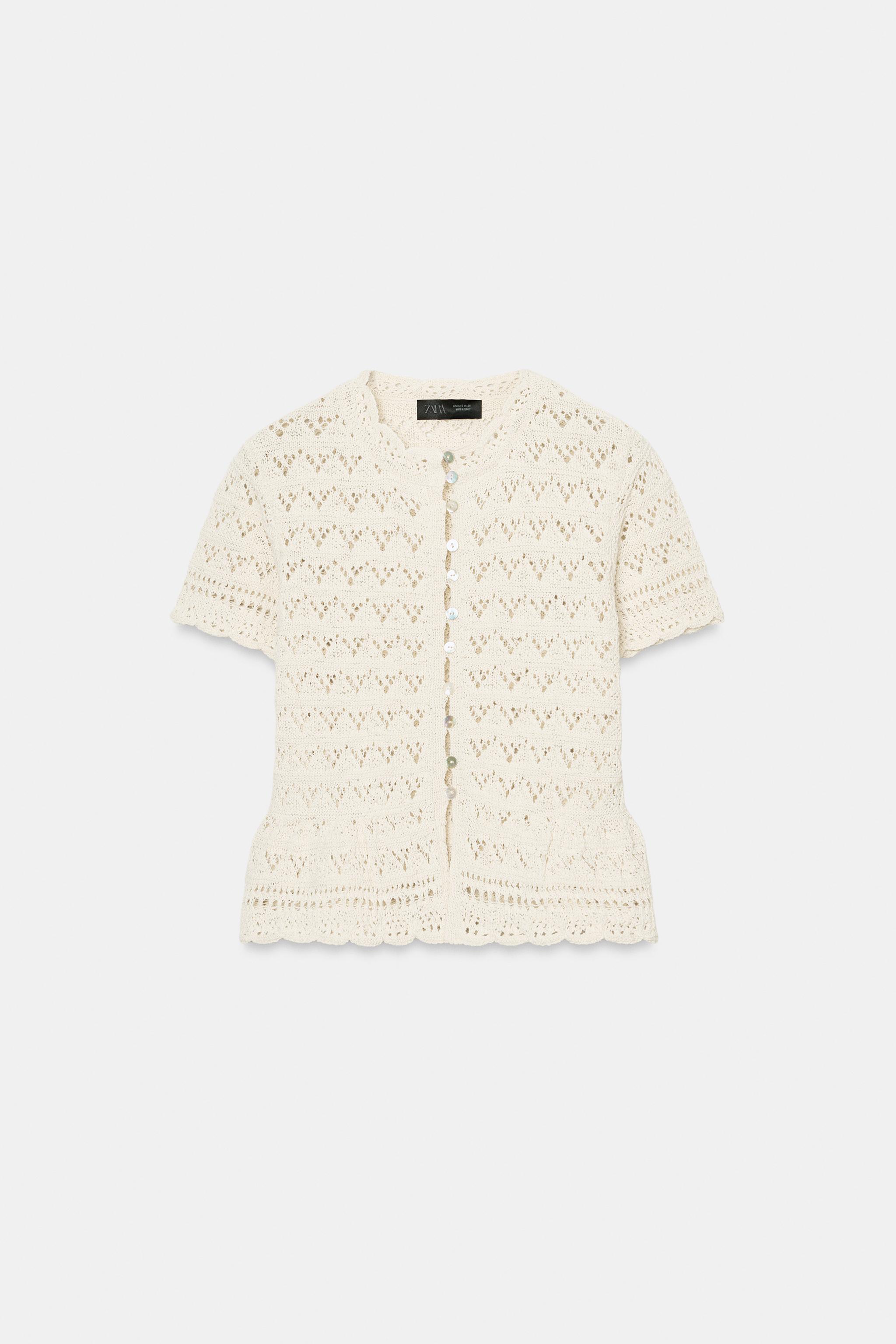 GILET EN MAILLE POINTELLE À MANCHES COURTES