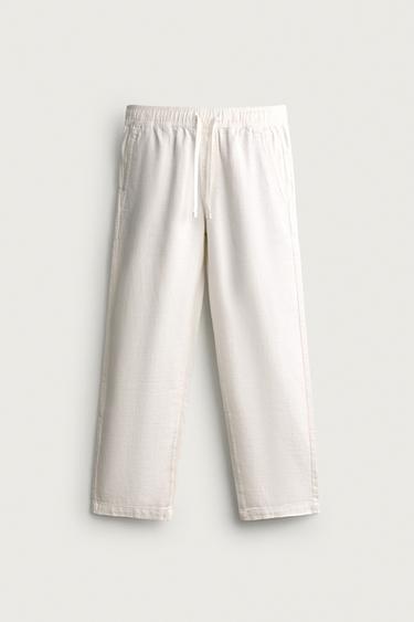 بنطلون RELAXED FIT هيكلي - أبيض مكسور الخاص بـ Zara