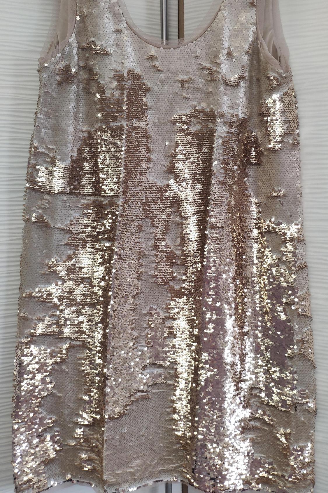 Front view of short dress with gold sequins