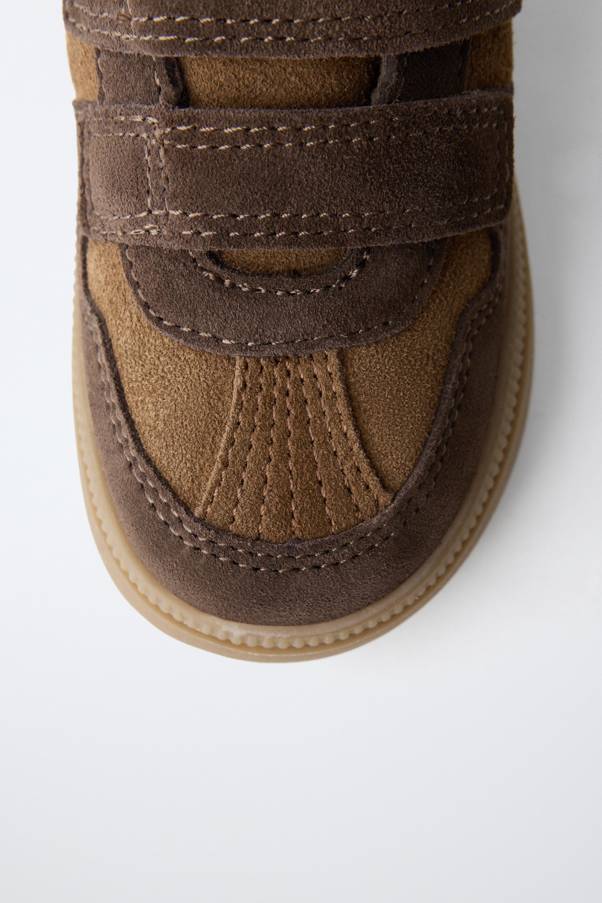 BASKETS MONTANTES EN CUIR