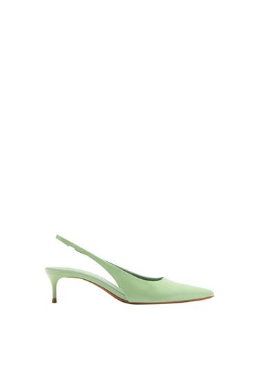 Light green slingback shoe with a low heel and pointed toe, photographed in profile against a white background.