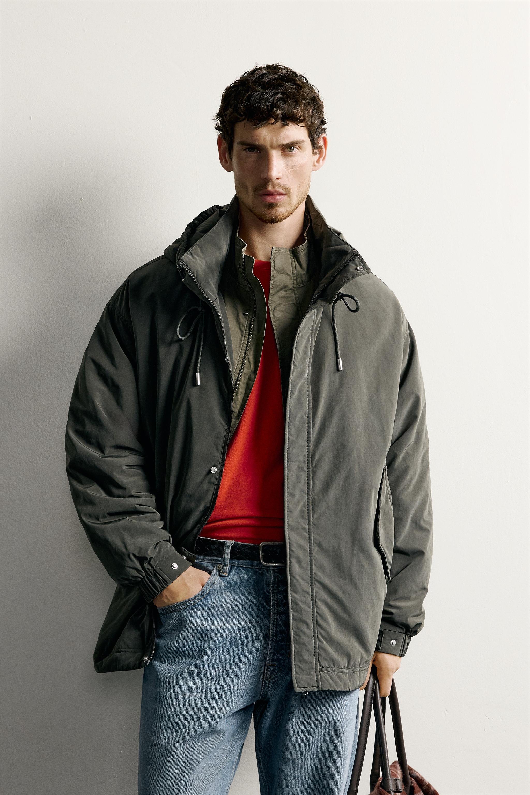 BLOUSON TECHNIQUE À CAPUCHE DÉPERLANT
